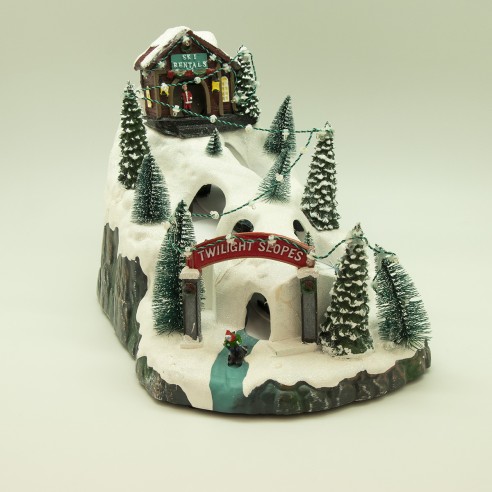 Villaggio di Natale musicale con luci e montagne innevate Domus